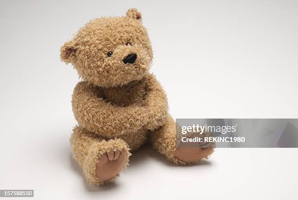 light brown stuffed bear sitting on white surface - teddy bear 個照片及圖片檔