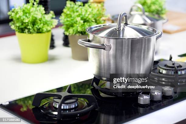 cooking saucepan on stove - hot burner - saucepan stock pictures, royalty-free photos & images