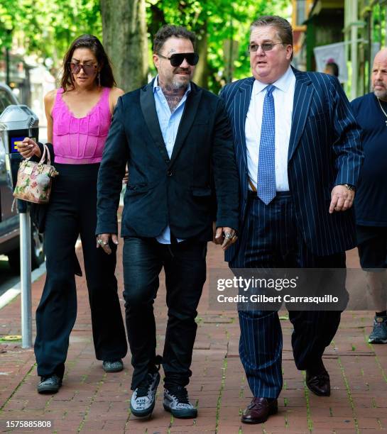 Dannii Marie, Bam Margera and William J. Brennan are seen arriving to Chester County Justice Center on July 27, 2023 in Philadelphia, Pennsylvania.