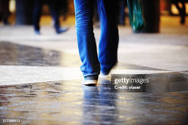 pedestrian crossing rain wet square - stockholm people stock pictures, royalty-free photos & images