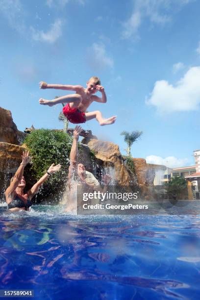 family fun on vacation - playground equipment happy parent stock pictures, royalty-free photos & images