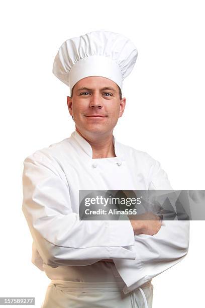 portrait of happy smiling cook in  chefs hat and uniform - chef stockfoto's en -beelden