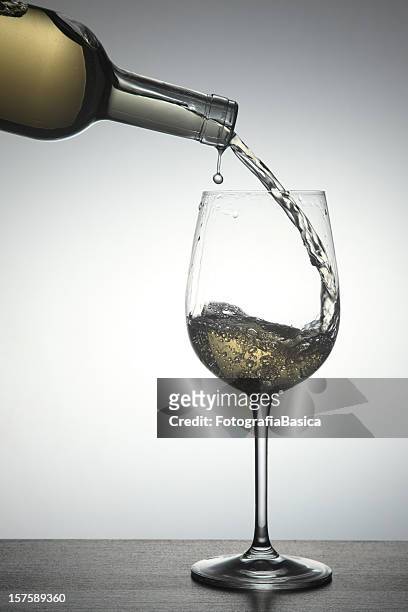 pouring white wine - bottle white wine stock pictures, royalty-free photos & images