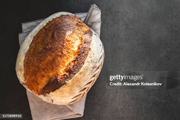 fresh bread on table close-up. the healthy eating and traditional bakery concept. - bread close up stock-fotos und bilder