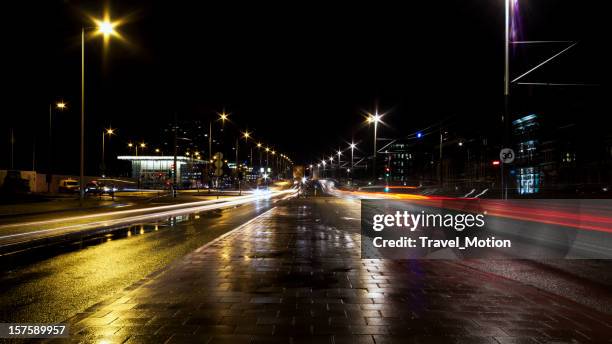 traffic car light trails, amsterdam - wet asphalt stock pictures, royalty-free photos & images