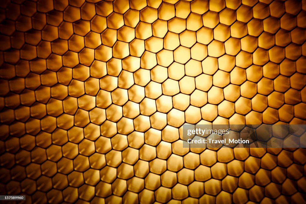 Gold yellow honeycomb grid mesh background texture