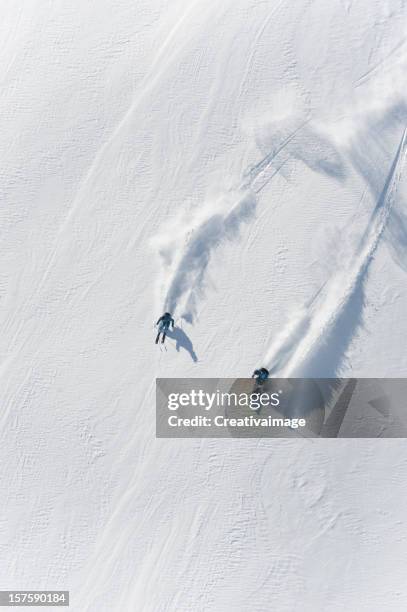 i love skiing in powder snow - heli skiing stock pictures, royalty-free photos & images