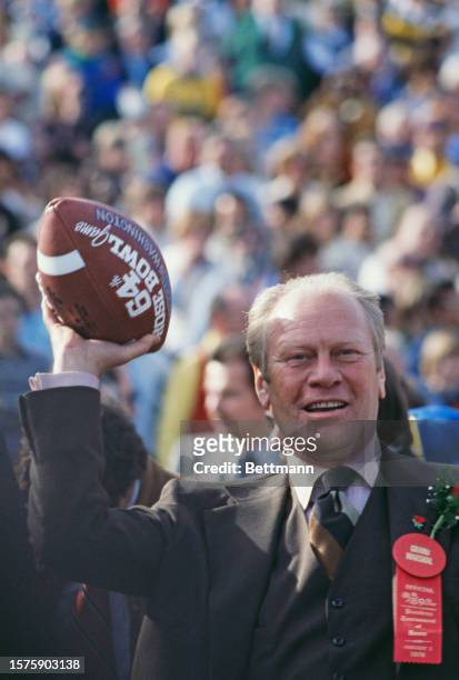 Former US President Gerald Ford throws out the ball to start the Rose Bowl game between the University of Washington Huskies and the Michigan...