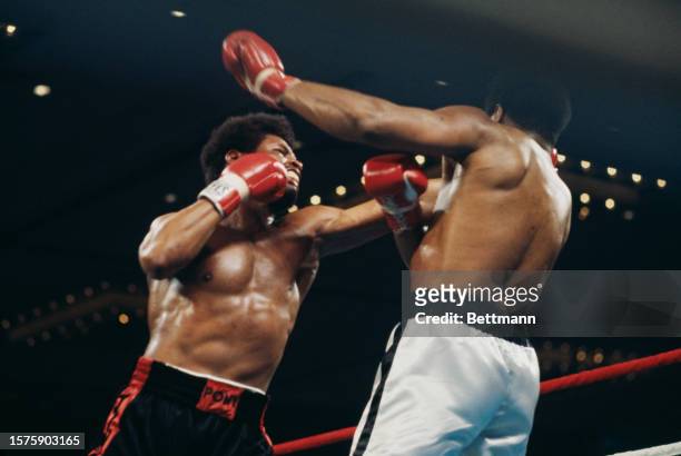 Muhammad Ali and Leon Spinks in action during a boxing match for the world heavyweight title at the Hilton Pavilion in Las Vegas, Nevada, February...