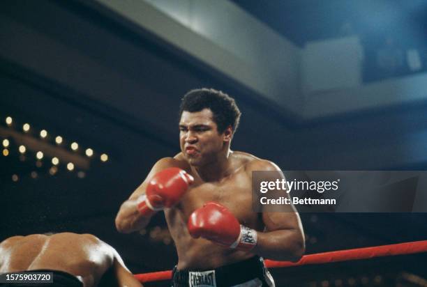 Muhammad Ali in action against Leon Spinks during a boxing match for the world heavyweight title at the Hilton Pavilion in Las Vegas, Nevada,...