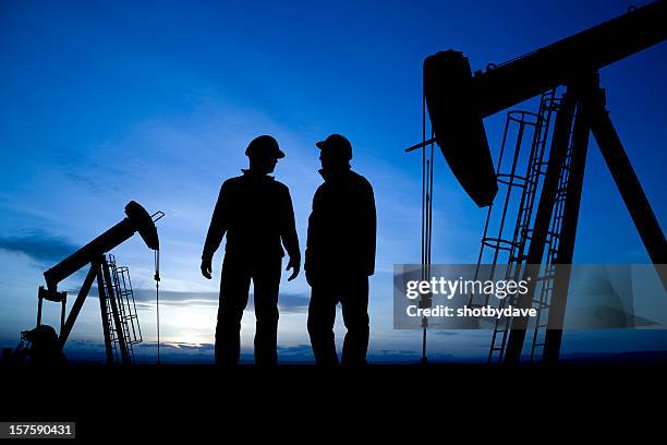 pumpjacks at dusk - oil pump stock pictures, royalty-free photos & images