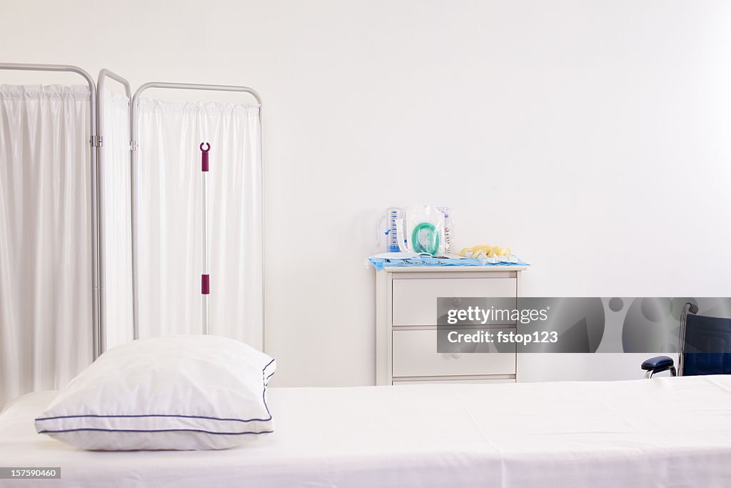 Emergency room or doctor's office with bed partician and wheelchair