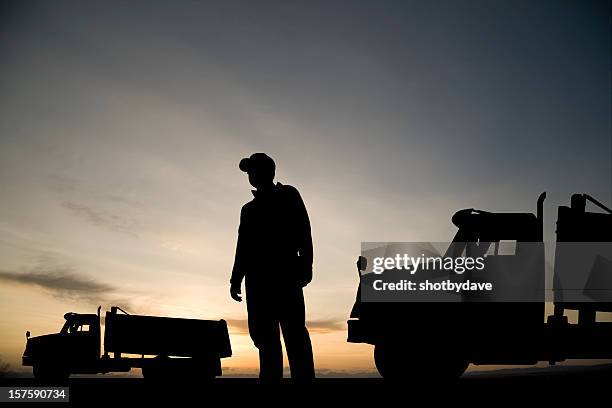dump truck driver - construction site and silhouette stock pictures, royalty-free photos & images