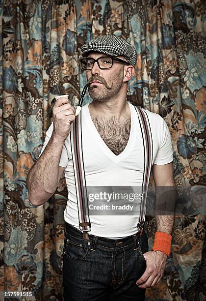 hipster in glasses smoking a pipe - suspenders stock pictures, royalty-free photos & images