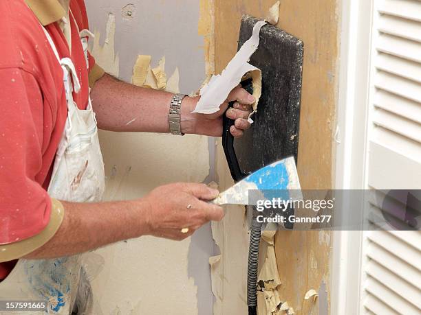 decorator stripping wallpaper - removing stock pictures, royalty-free photos & images