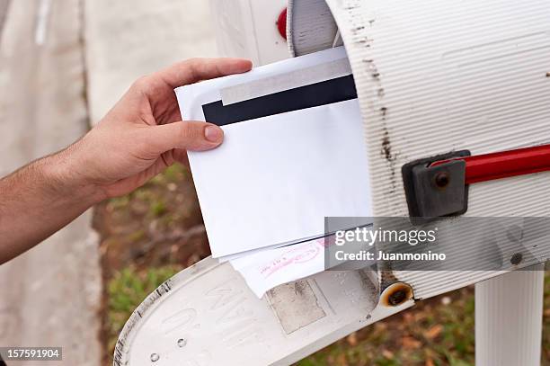 male human hand getting the mail - good news letter stock pictures, royalty-free photos & images