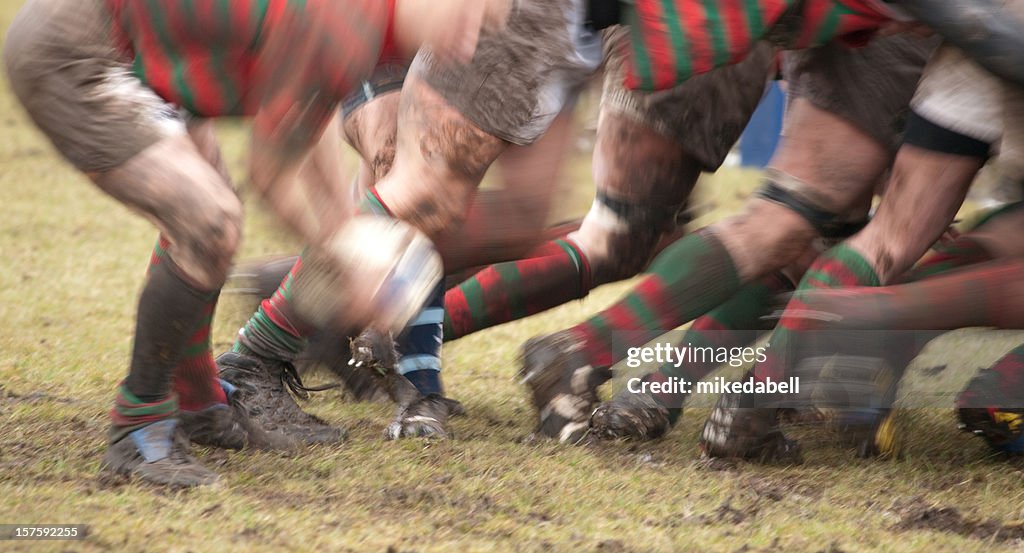 Lower body view of rugby scrum in action