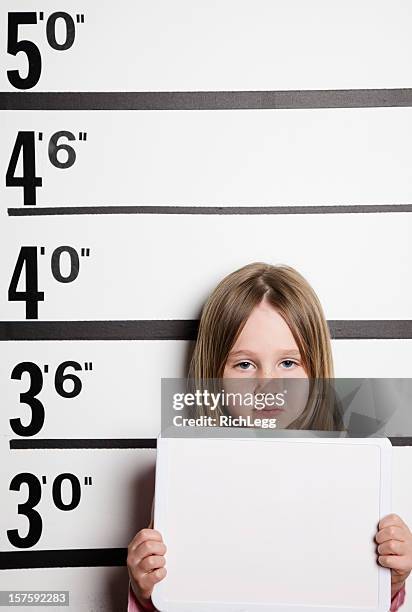 mugshot of a little girl - girl mugshots stock pictures, royalty-free photos & images