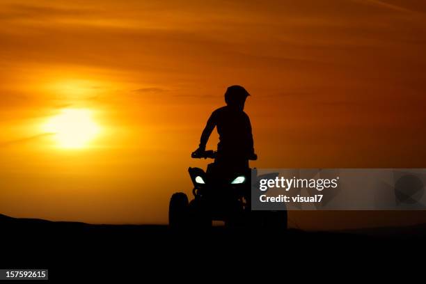 quadbike in the sunset - off road vehicle stock pictures, royalty-free photos & images