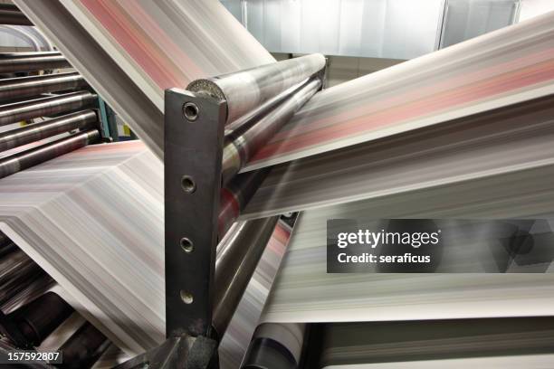 close-up of newspapers printing in action - drukken stockfoto's en -beelden