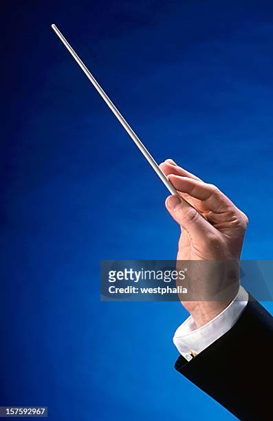 conductor's hand - conductor's baton stock pictures, royalty-free photos & images