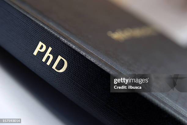 phd thesis hardbound cover macro - dissertation stock pictures, royalty-free photos & images