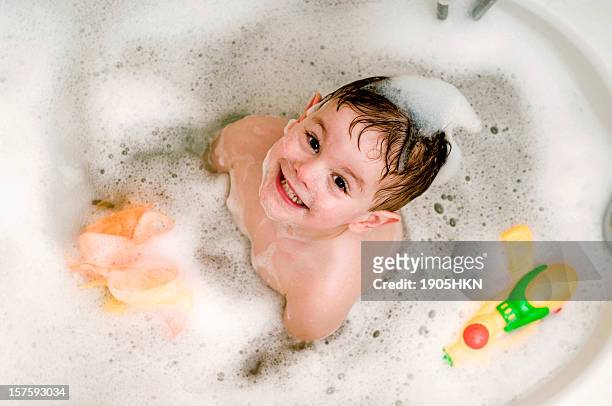 bathtub memories - taking a bath stock pictures, royalty-free photos & images
