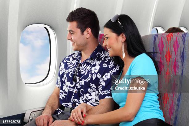 airplane travelers - passenger cabin stock pictures, royalty-free photos & images