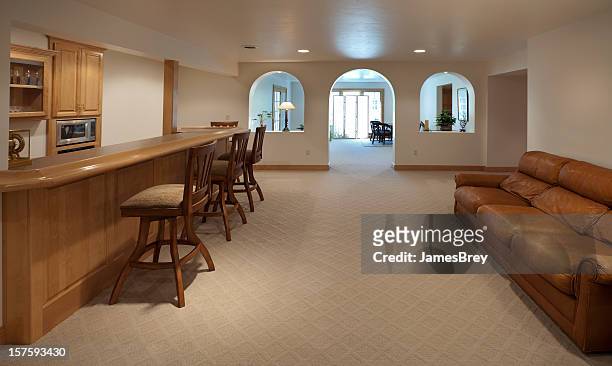 large finished carpeted basement with bar - basement stock pictures, royalty-free photos & images