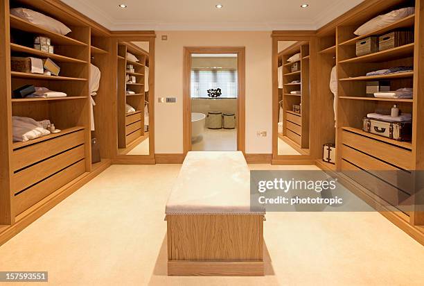 luxury walk-in wardrobe - wardrobe stock pictures, royalty-free photos & images