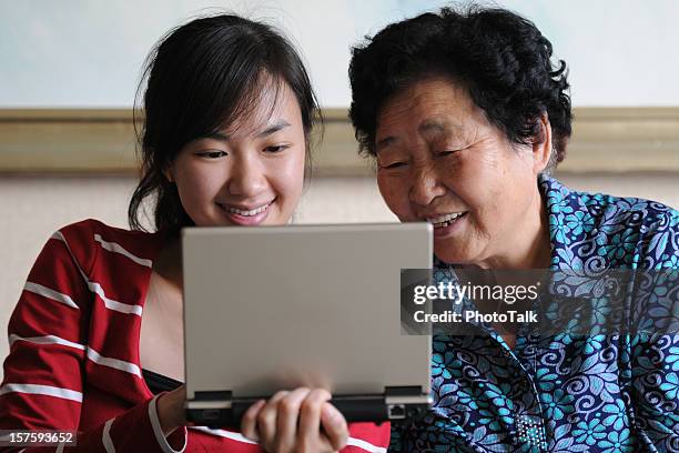 watching laptop - xlarge - pleased face laptop stock pictures, royalty-free photos & images