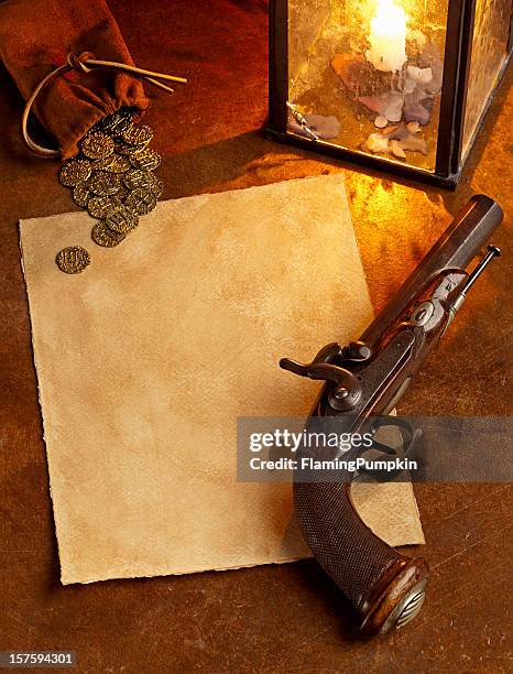 blank paper with antique pistol and gold coins. vertical. - wanted poster background stock pictures, royalty-free photos & images