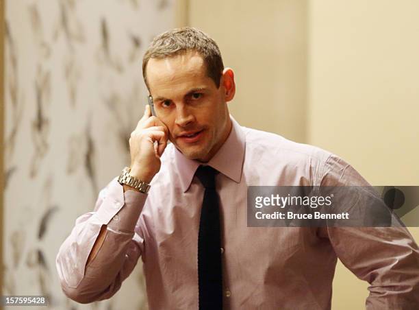 After a 5-1/2 hour negotiating session between the NHL and the Players Association, Craig Adams of the Pittsburgh Penguins speaks on the phone during...