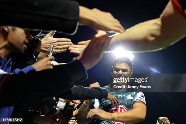 Latrell Mitchell of the Rabbitohs greets fans after their win during the round 22 NRL match between Wests Tigers and South Sydney Rabbitohs at Scully...