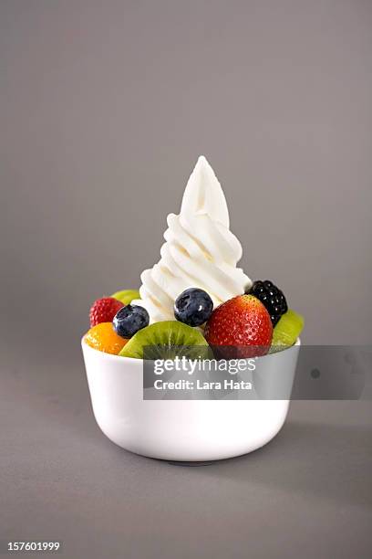 frozen yogurt with fresh fruit in a white bowl - mr whippy ice cream stock pictures, royalty-free photos & images