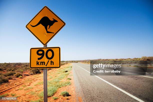 australia kangaroo sign at lonely country road - western australia road stock pictures, royalty-free photos & images