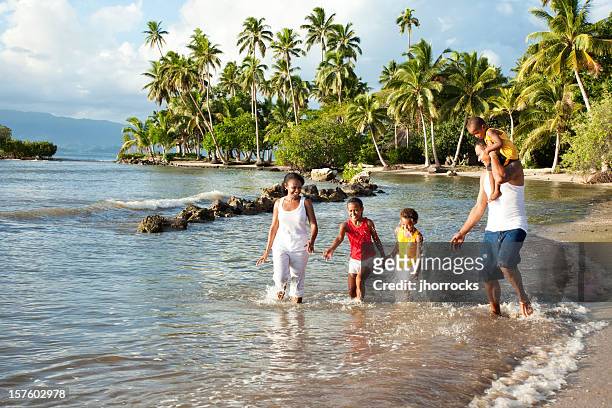 fijian family playing on the beach - fiji stock pictures, royalty-free photos & images