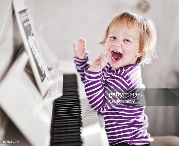 piano girl - toddler musical instrument stock pictures, royalty-free photos & images