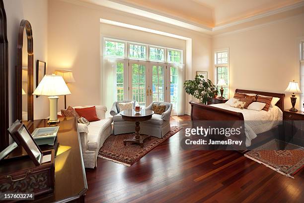 bright spacious master bedroom interior design with sitting area - feng shui house stock pictures, royalty-free photos & images