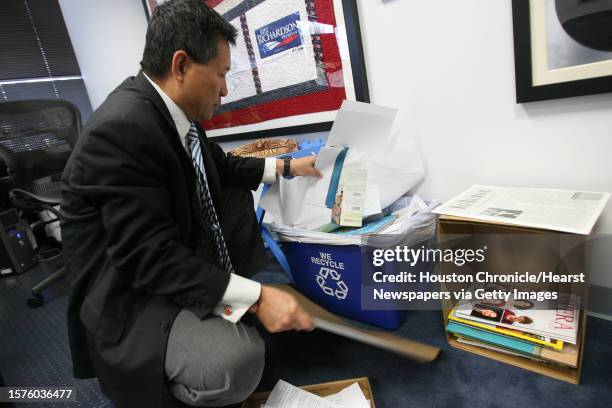 Attorney Minh Tran sorts through paper, magazines, and card borad as he heads up a recycling program at Law firm of Goldstein, Faucett & Prebeg where...