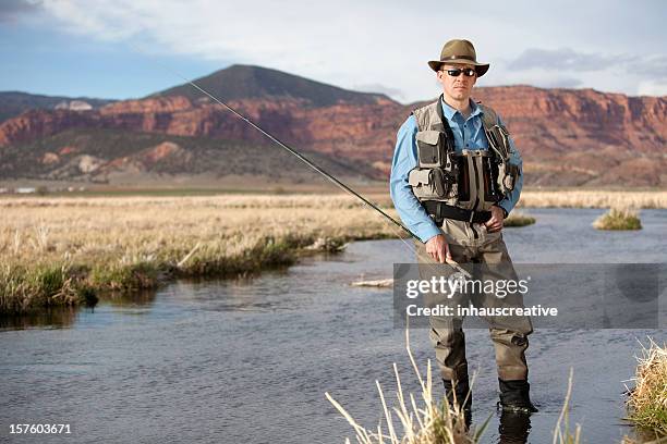 fly fisherman - wading boots stock pictures, royalty-free photos & images