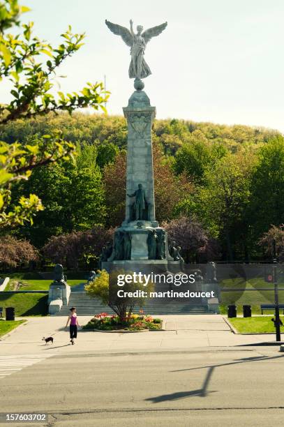 the angel of mont-royal on park avenue, montreal, summer. - royal parks stock pictures, royalty-free photos & images