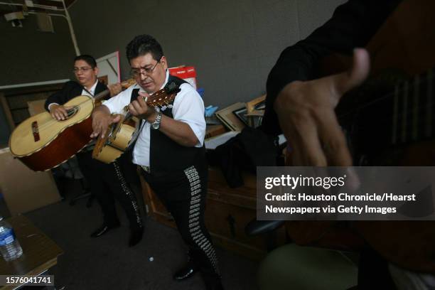 Edgar Cazares, Raul Medina, and Roman Salinas of Mariachi MECA rehearse before the Heineken Green Ribbon presentation where MECA of Houston and...