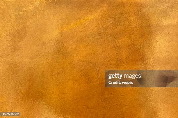 golden brass metal plate background textured surface xl - bronze colored stockfoto's en -beelden