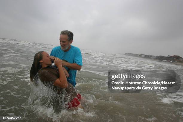 Alexa Heichelheim is baptized by Pastor Kelley Vaughan during a Seaside Baptist Church Easter Sunrise service on the beach on April 12, 2009 in...