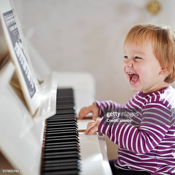 piano girl - toddler musical instrument stock pictures, royalty-free photos & images