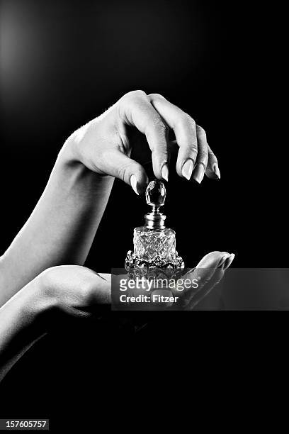 beautiful hands and luxury perfume bottle - perfume sprayer stock pictures, royalty-free photos & images