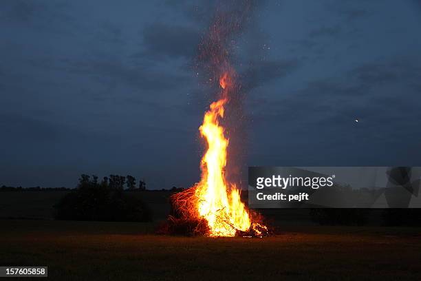 bonfire at midsummer with moon in the sky - pejft stock pictures, royalty-free photos & images