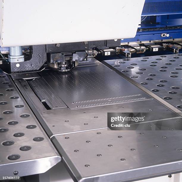 close up of a punching machine - sheet metal with holes stock pictures, royalty-free photos & images