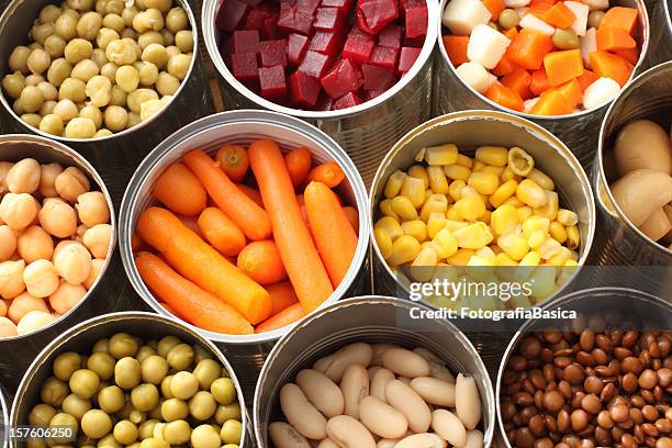 high angle view of cans filled with vegetables - konserverad bildbanksfoton och bilder